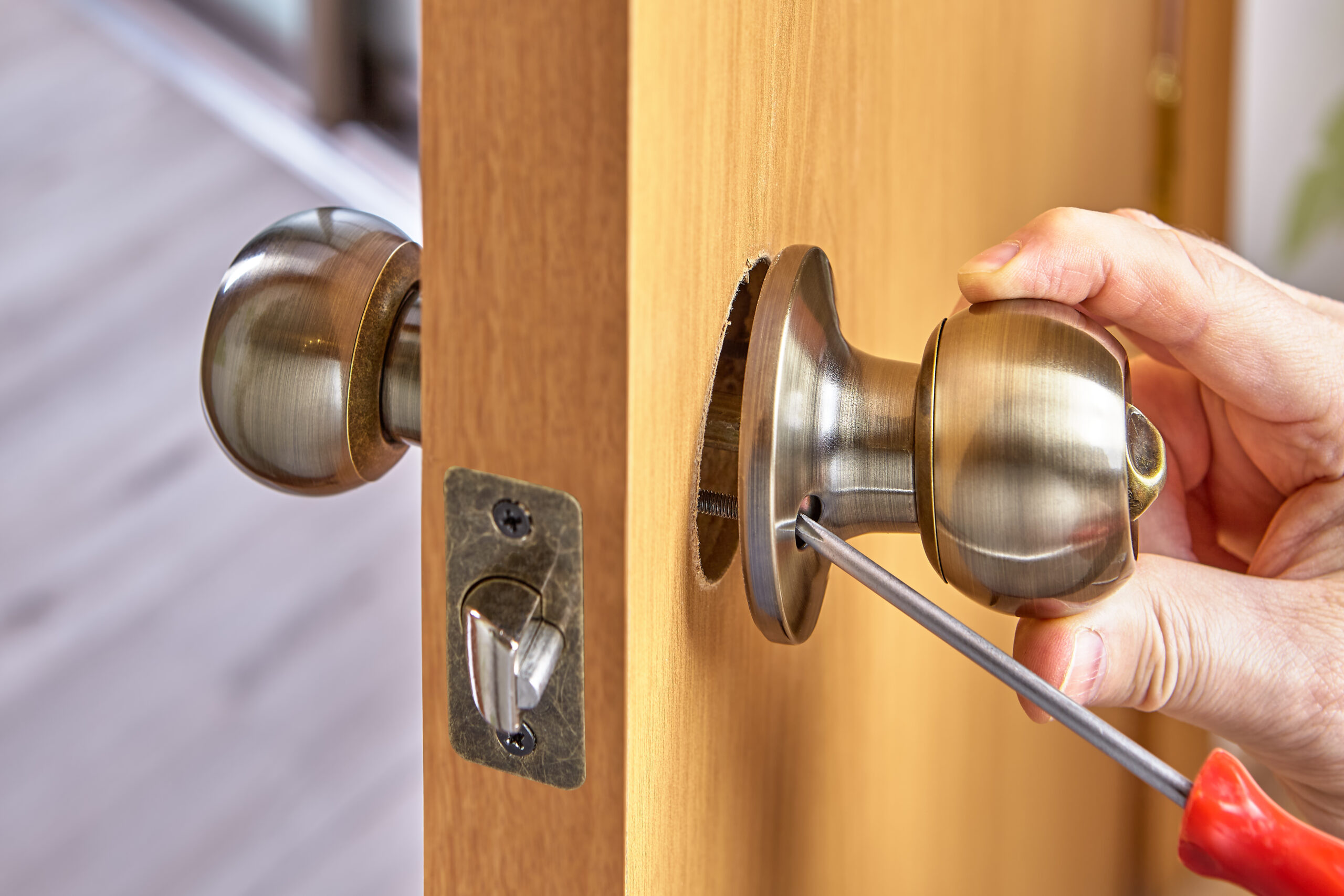 DIY installation of door lock mechanism with handles in new wood